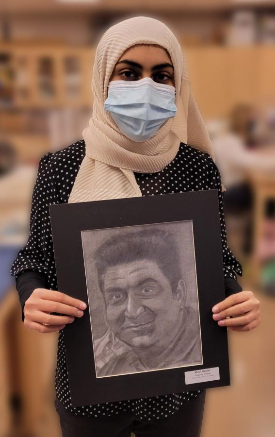 Minal displays the portrait from her hero project.