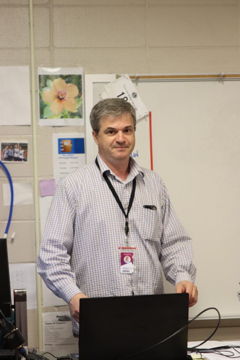 Dr. Zaslavsky preparing to teach chemisty in room nine.

Photograph courtesy of Hampton Bays Yearbook.