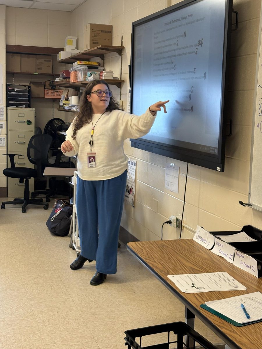 Ms. Sexton teaching geometry to her students.
