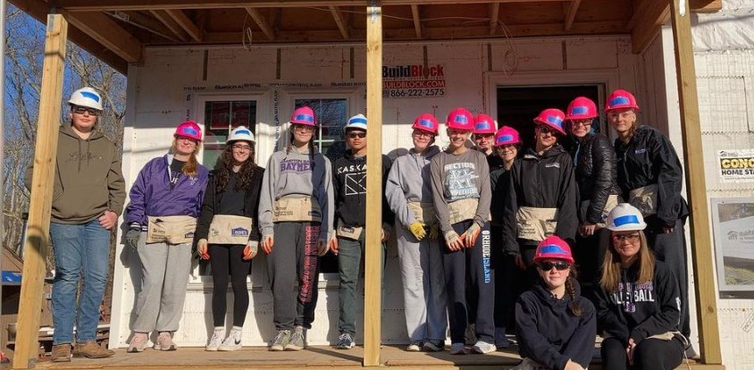 A team of Interact Club members from Hampton Bays High School in front of one of their Habitat For Humanity builds.

Photo credit: Nicole Mahoney
